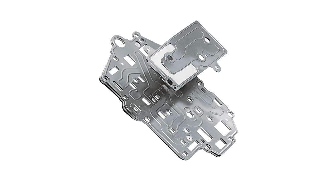 Optimally sealed transmission control plates help to minimize leakage losses and improve switching and response times. Pictured: MetaloSeal transmission control plate with integrated filter function.